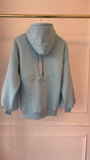 "Blush" CRISTALE sweatshirt with bare back and bell sleeves BABY BLUE