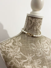 Load image into Gallery viewer, Necklace Diva with pearls at the base of the neck by Shirley Navone with gold-plated metal details.
